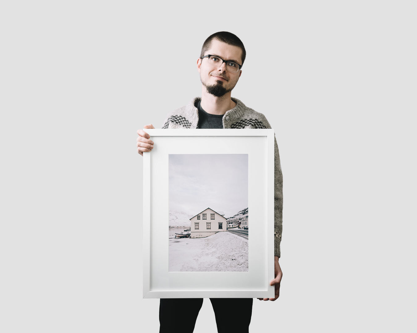Nordic travel photography print featuring an old white house in Seydisfjordur, Iceland, in winter