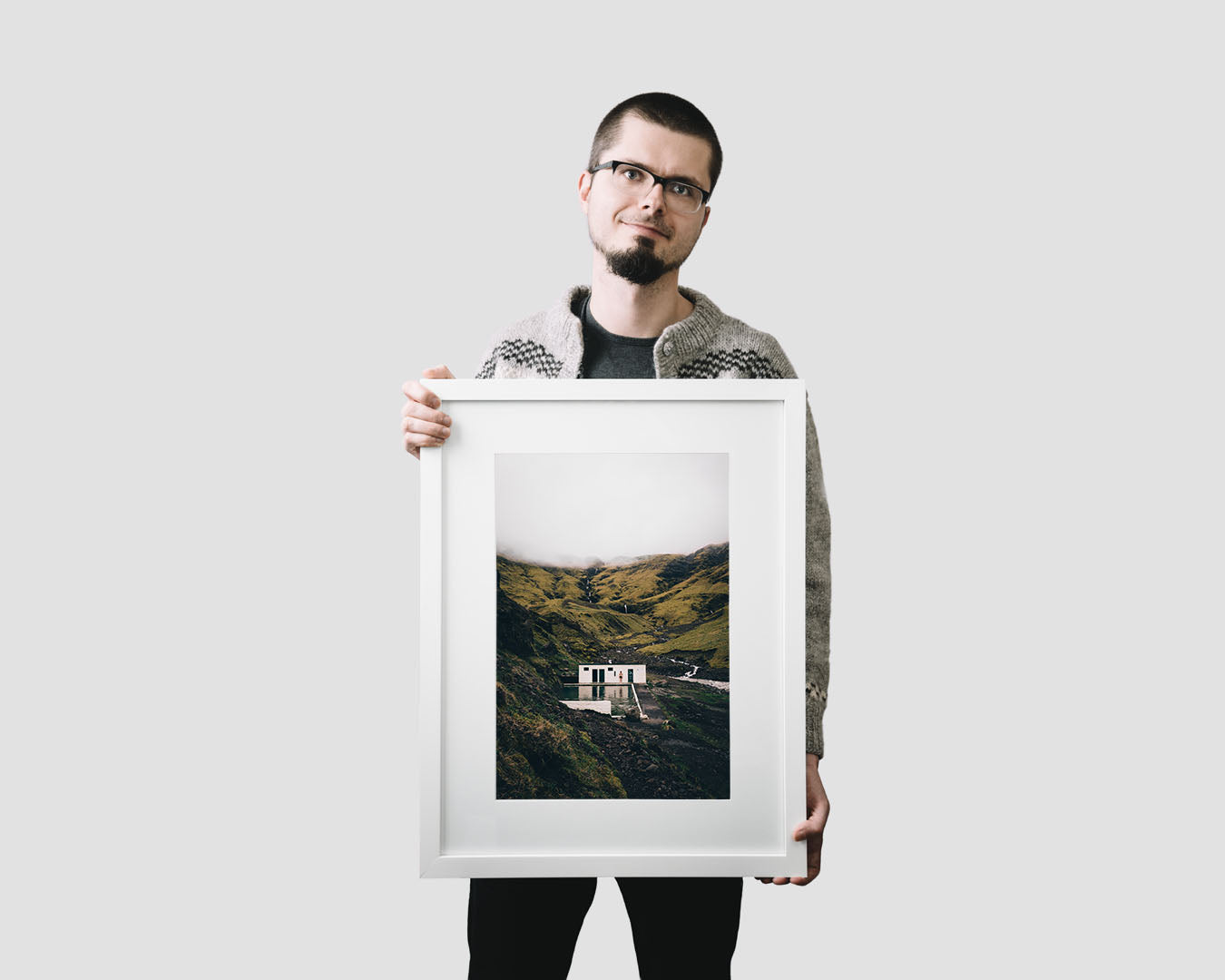 Nordic travel photography print featuring the abandoned swimming pool of Seljavallalaug in the mountains in Iceland