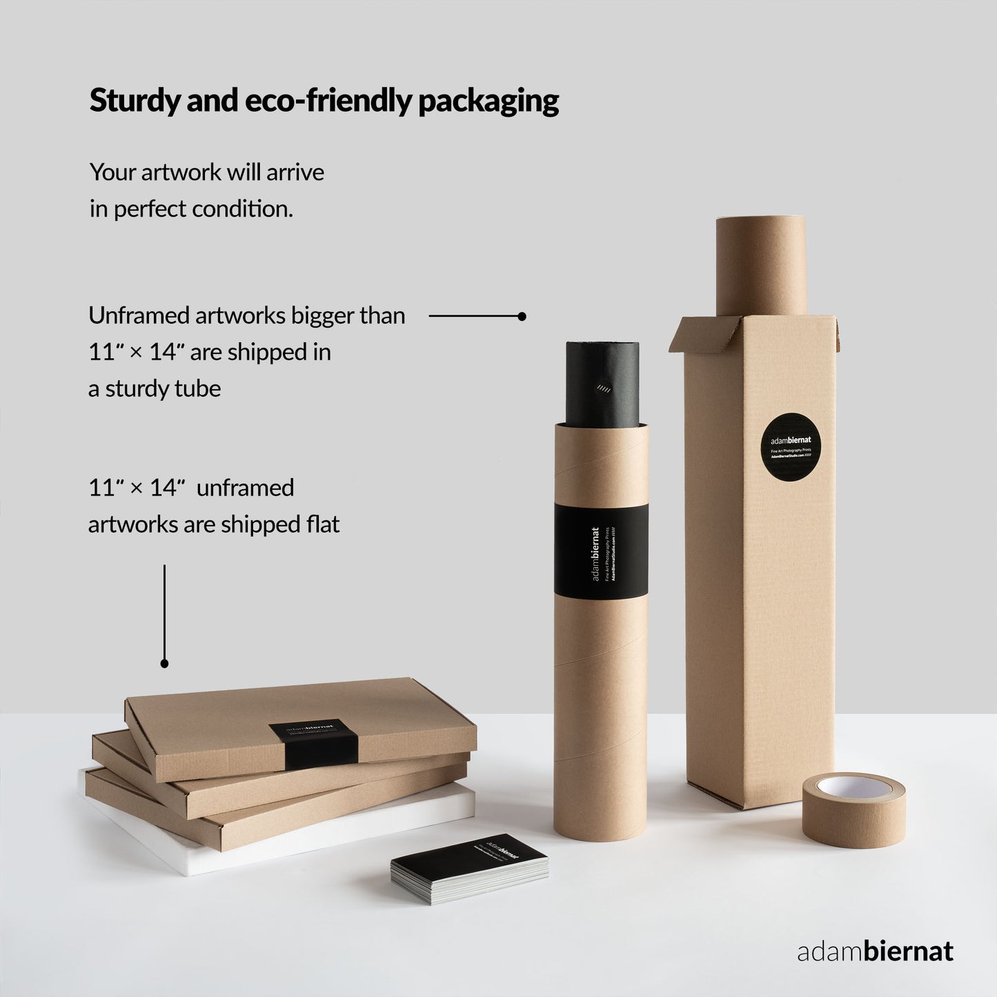Eco-friendly packaging for artworks with cardboard tubes and boxes on a white background.