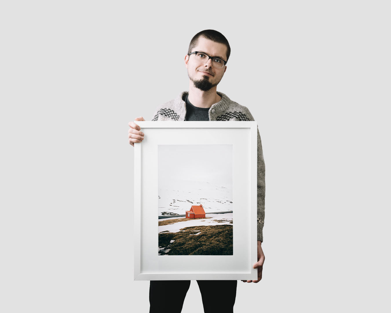 Nordic travel photography print featuring a lonely red cabin in Iceland in winter