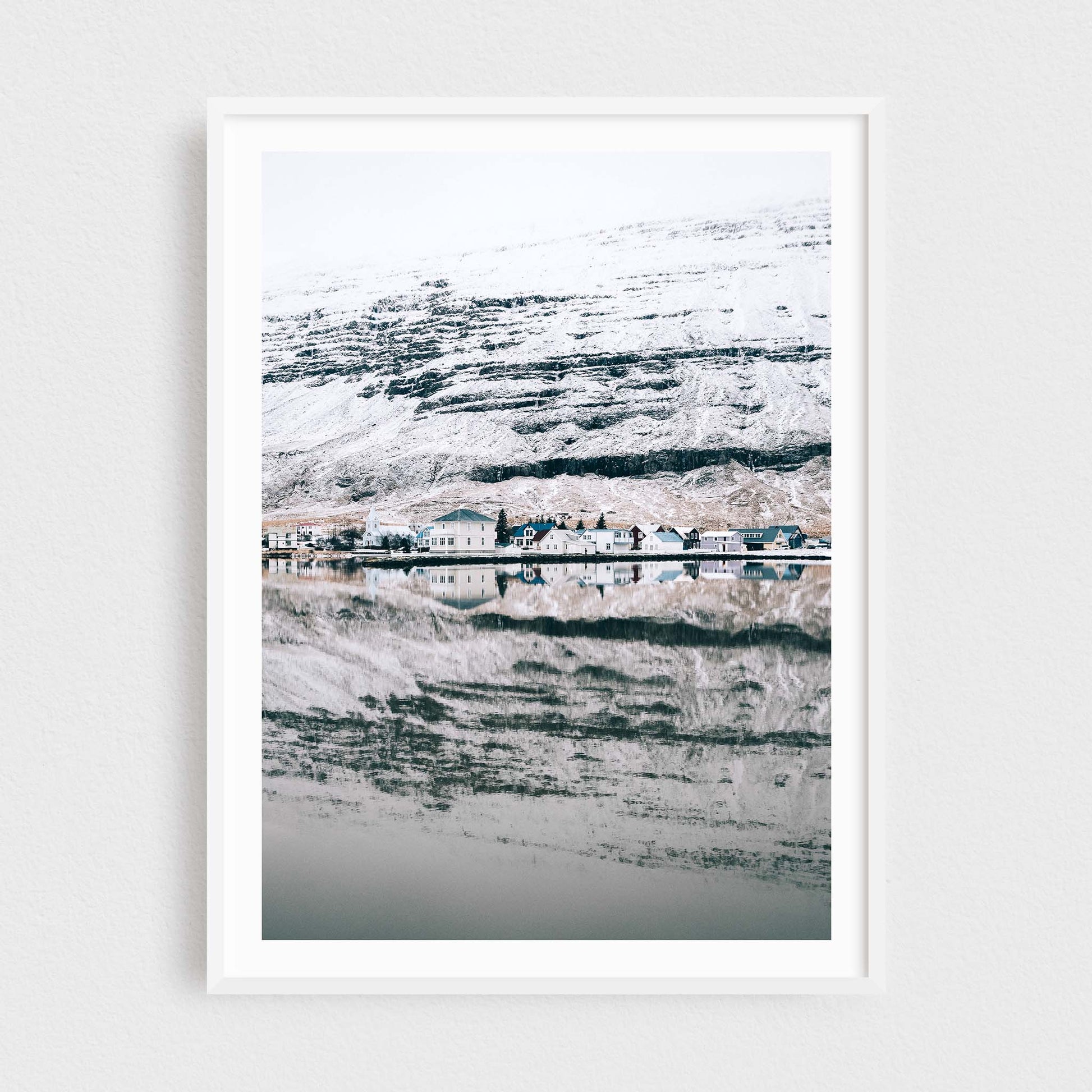 Iceland fine art photography print featuring Seydisfjordur in winter, in a white frame