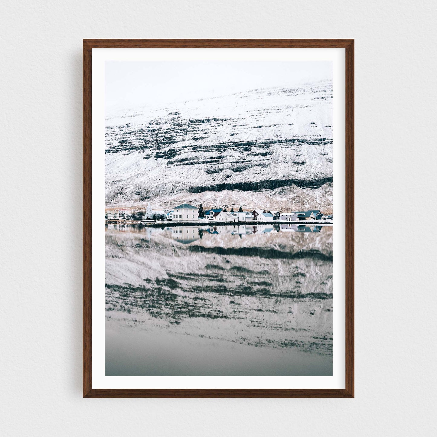 Iceland fine art photography print featuring Seydisfjordur in winter, in a walnut frame