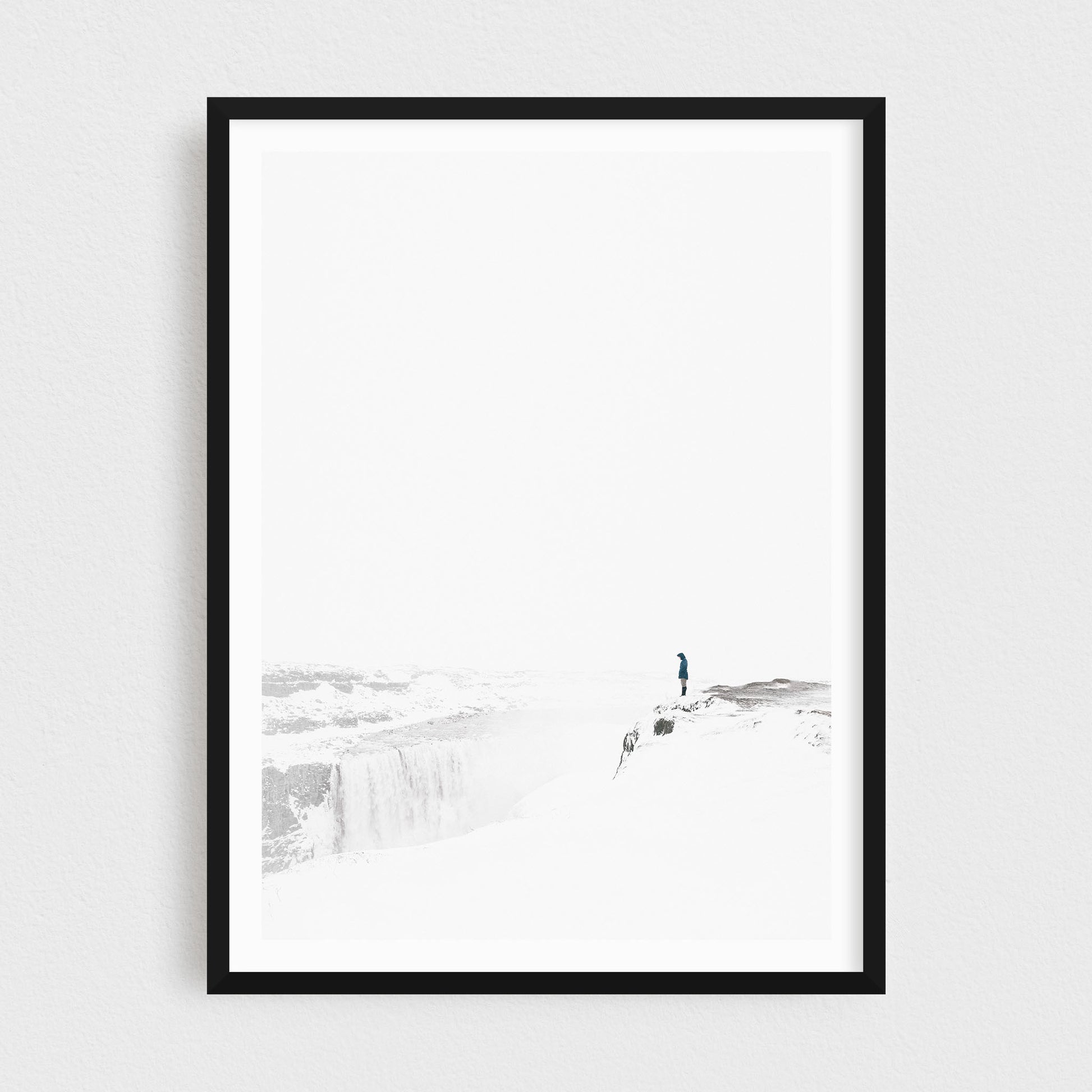 Iceland fine art photography print featuring Dettifoss waterfall in winter, in a black frame