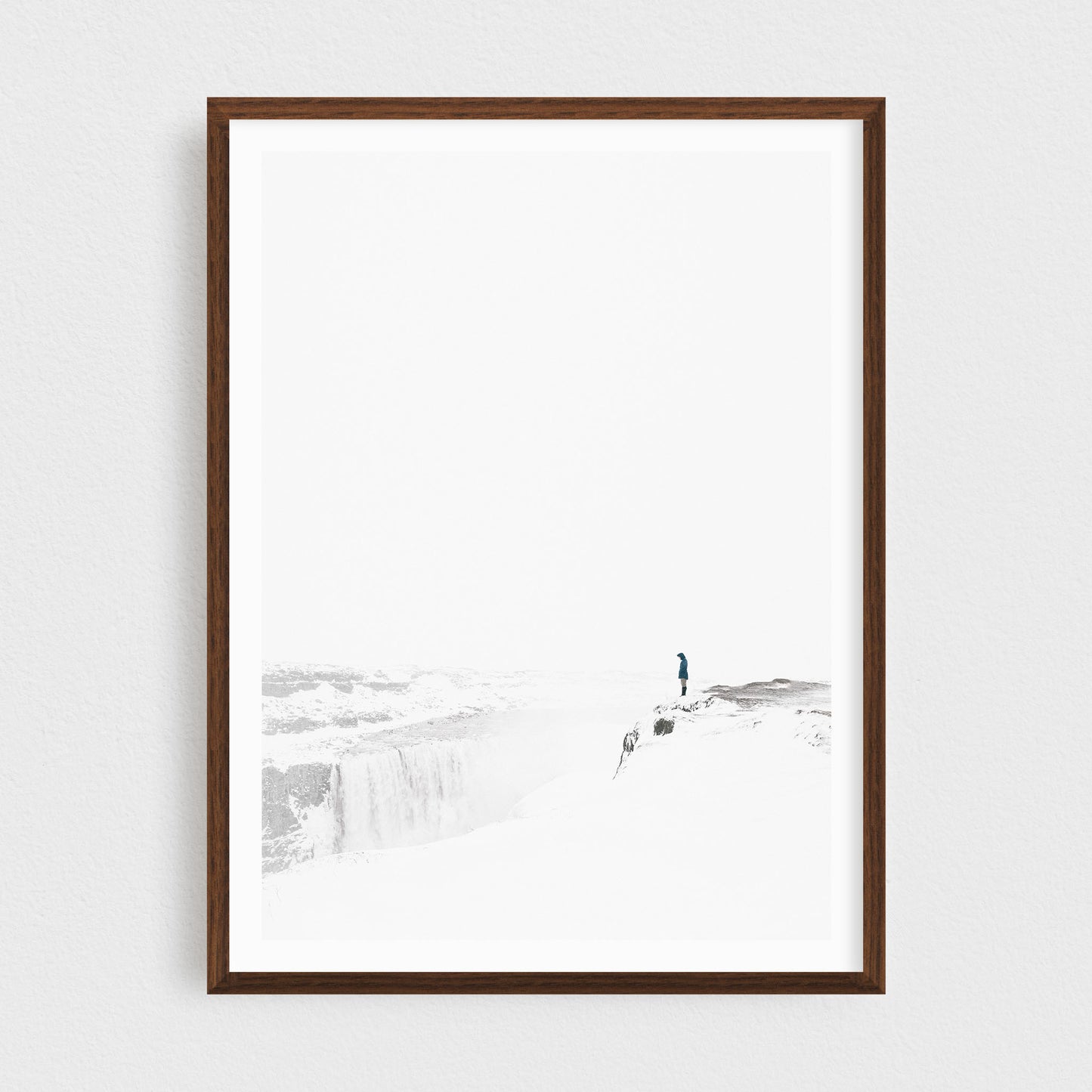 Iceland fine art photography print featuring Dettifoss waterfall in winter, in a walnut frame