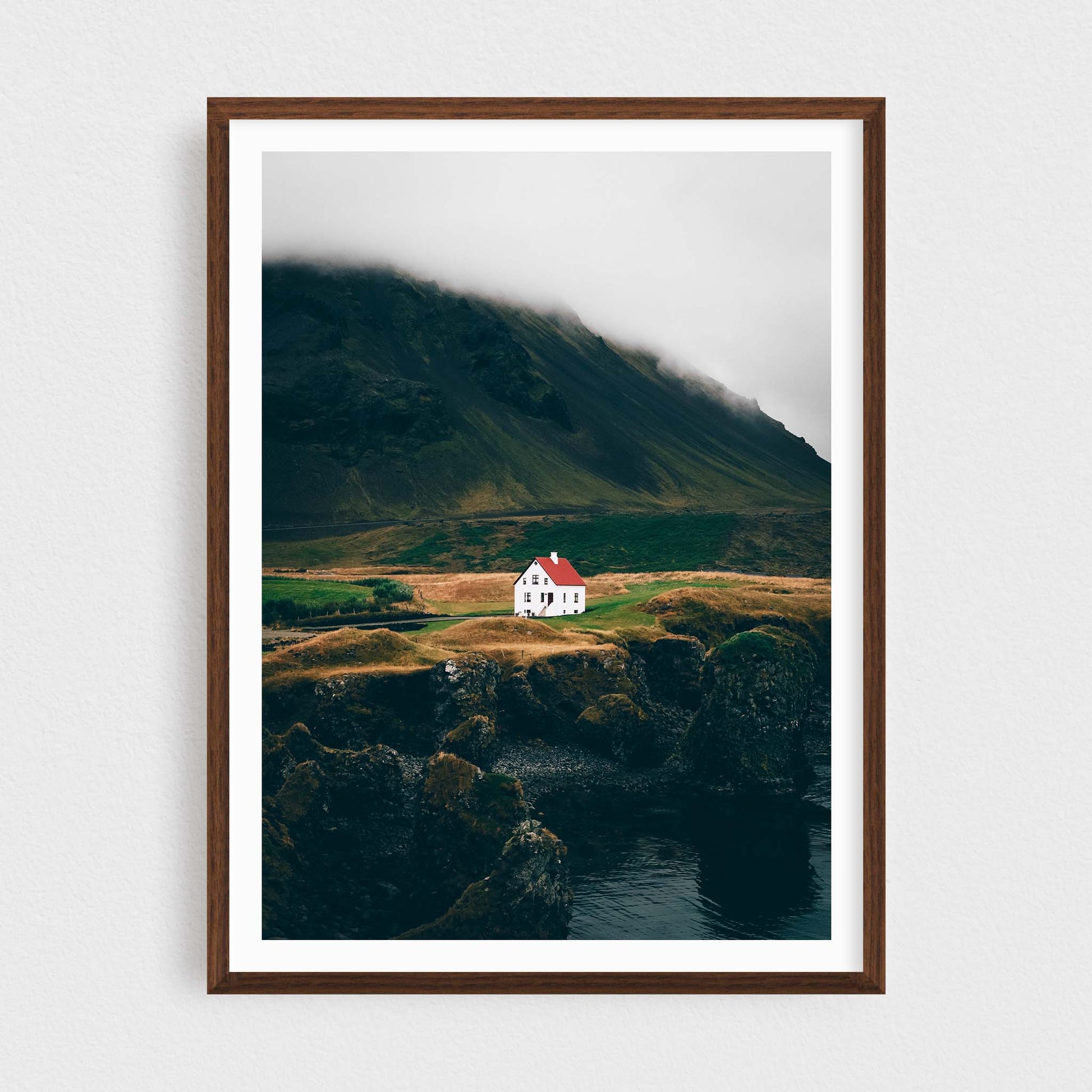 Iceland fine art photography print featuring Arnarstapi lonely house, in a walnut frame