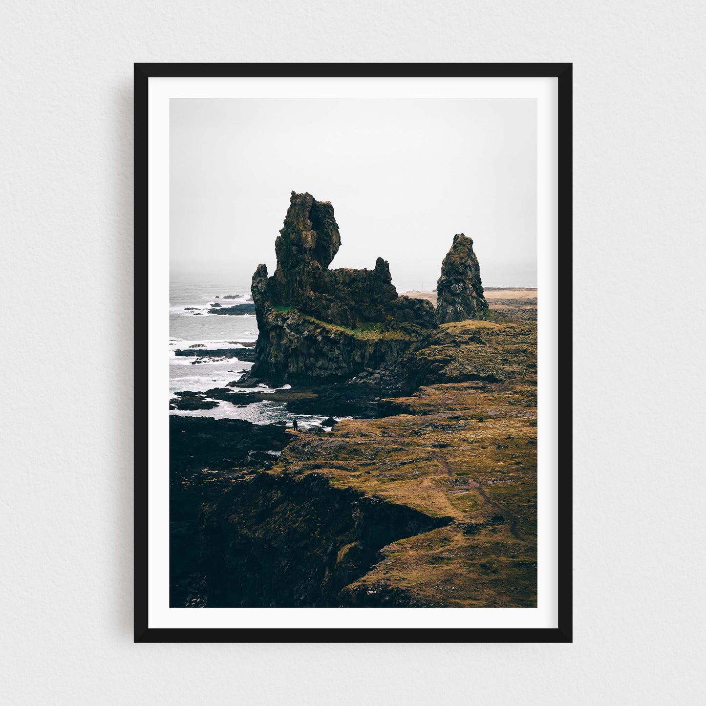 Iceland fine art photography print featuring Londrangar rock formations, in a black frame