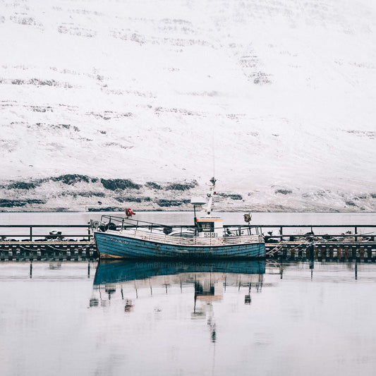 Old wooden fishing vessel in the fjord of Seydisfjordur in Iceland photography print